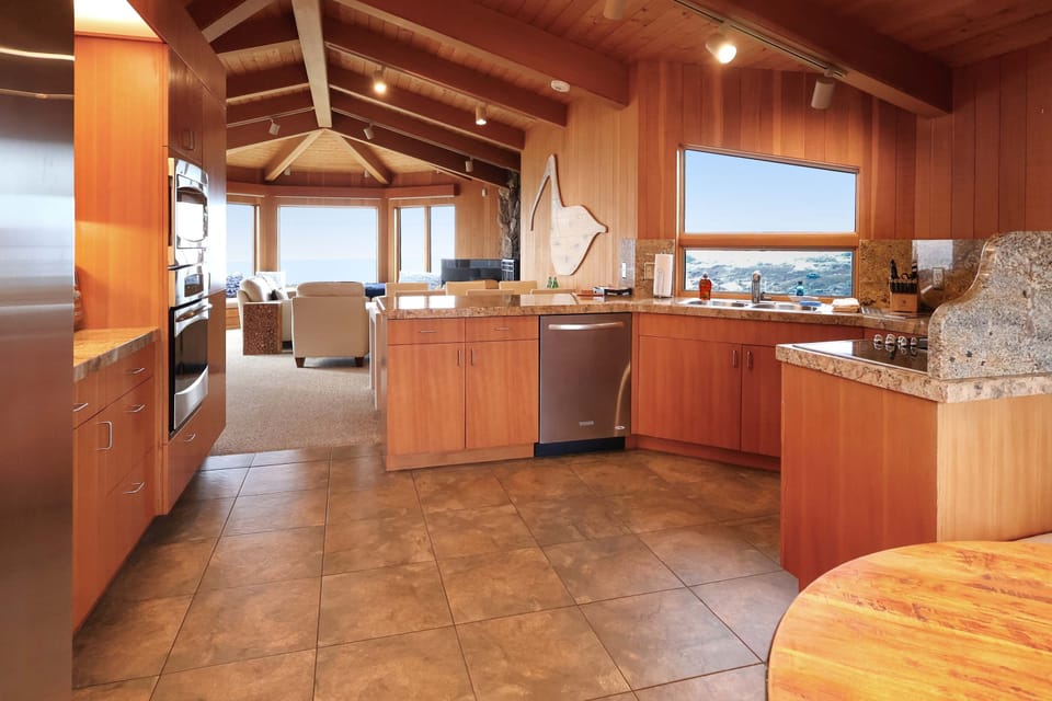 This spacious kitchen flows seamlessly into the living area, making it easy to entertain while enjoying breathtaking ocean views.