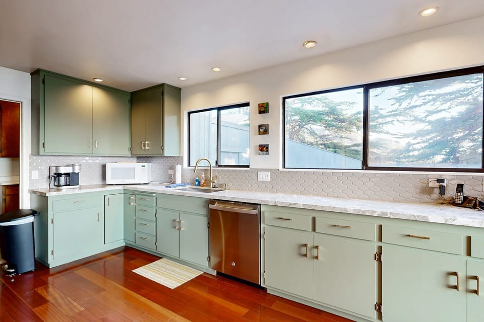With ample counter space and natural light streaming in, this kitchen invites you to whip up your favorite dishes while soaking in the tranquil atmosphere.