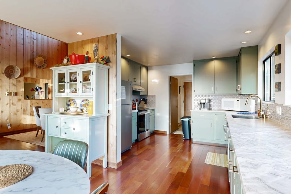 Cook up coastal-inspired meals in your well-equipped kitchen, where modern amenities meet scenic views to inspire your culinary creativity.