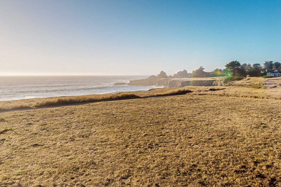 Marvel at the stunning ocean view from your retreat, where golden grasses sway gently in the breeze, inviting you to soak in the coastal beauty.