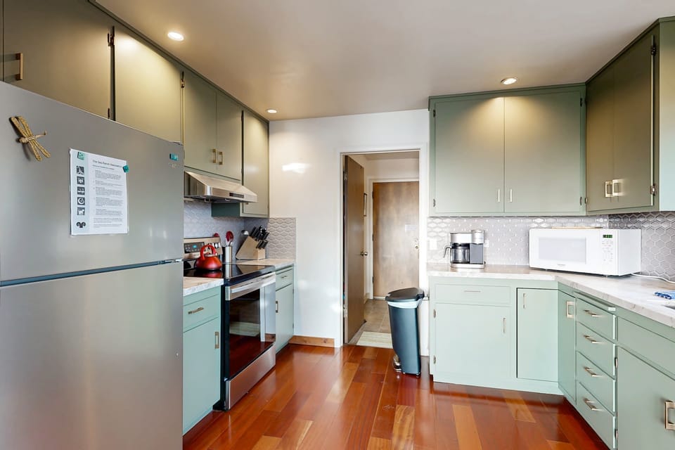 Enjoy the convenience of a thoughtfully designed kitchen, featuring everything you need to prepare snacks or gourmet feasts for your getaway.