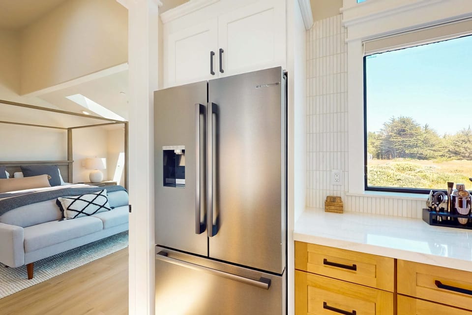 Convenience meets style with a sleek refrigerator and ample counter space, making it easy to store and prepare your favorite dishes.