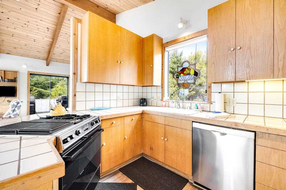 Bask in the morning sun at your kitchen sink, a perfect spot to catch a glimpse of nature while you sip your coffee.