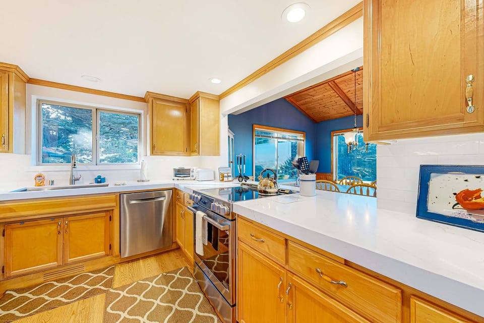 Craft culinary delights in this bright kitchen, where ample counter space and modern appliances inspire your inner chef.