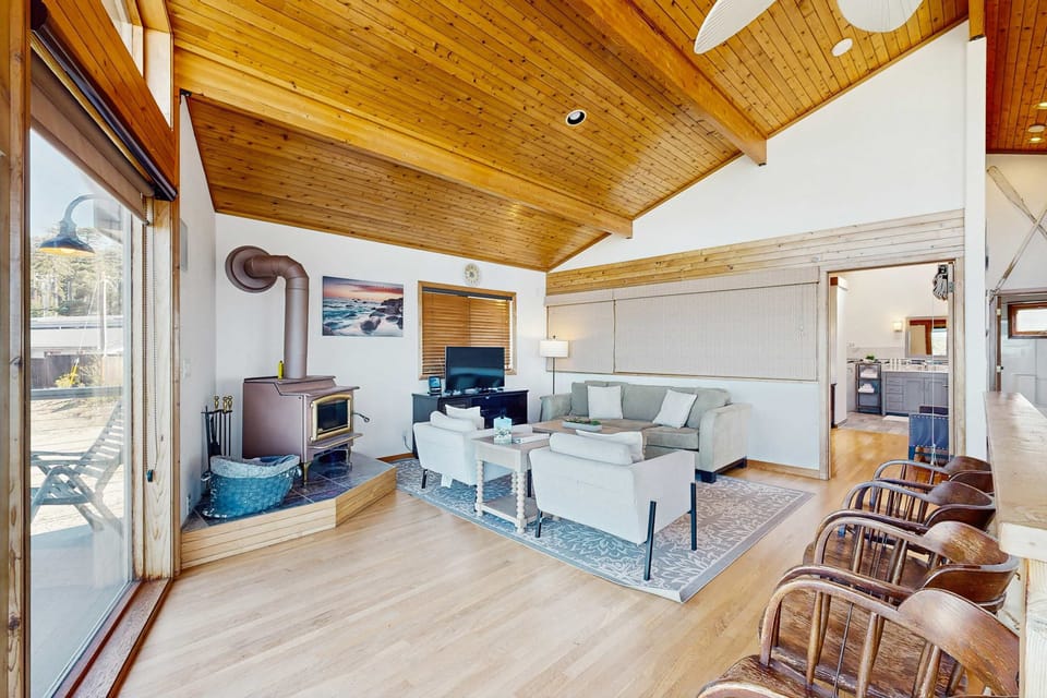 Experience the inviting atmosphere of this stylish living area, ideal for unwinding with loved ones after exploring the nearby beaches.