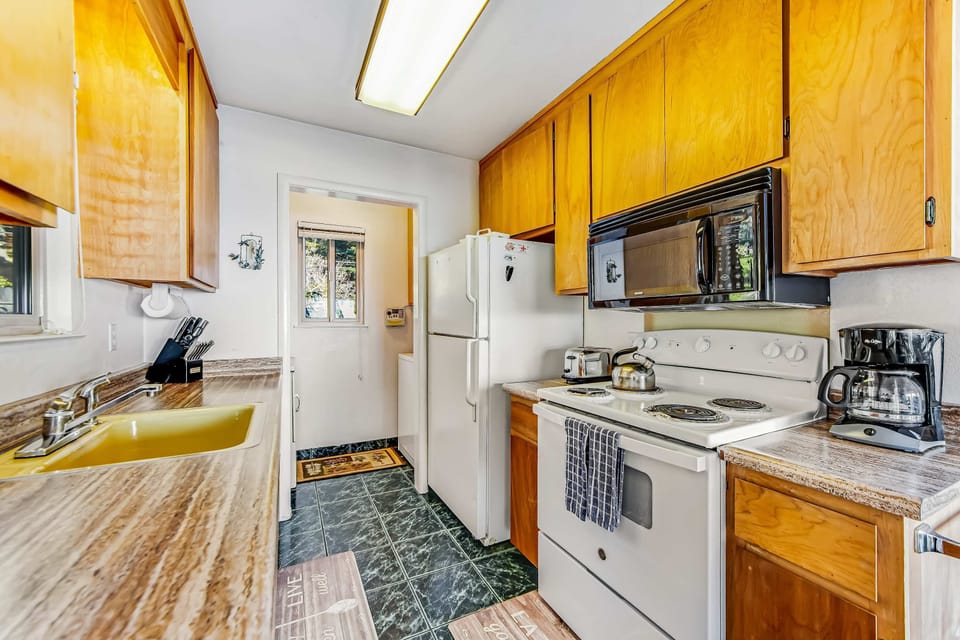 Your culinary creativity flourishes in this bright kitchen, with ample counter space and a layout that keeps you connected to the living area.