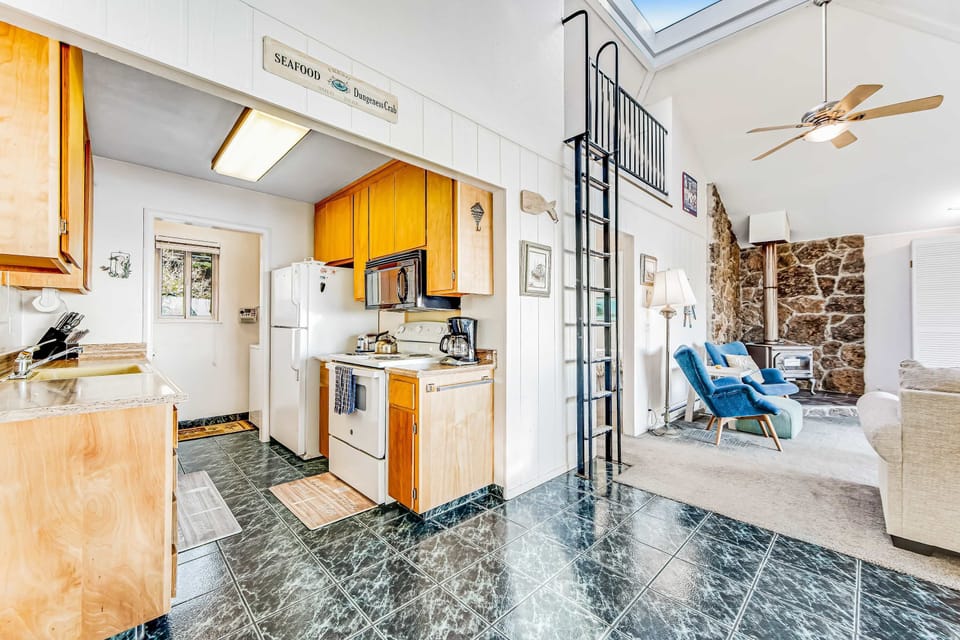 Cook up your favorite meals in the well-equipped kitchen, where every culinary adventure is accompanied by the charm of coastal living.