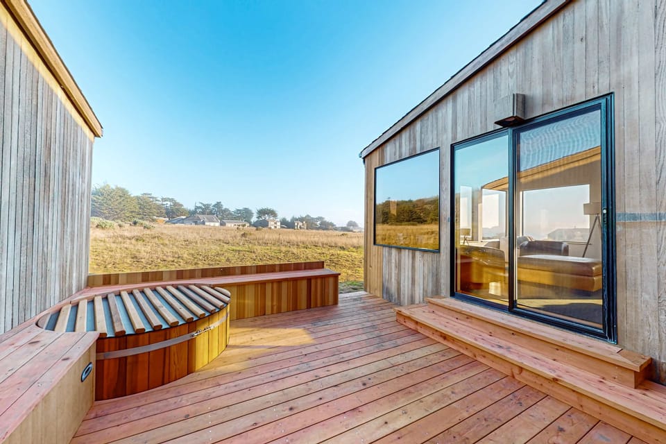 Step out onto your private deck, where the hot tub awaits and breathtaking views create the perfect backdrop for relaxation.