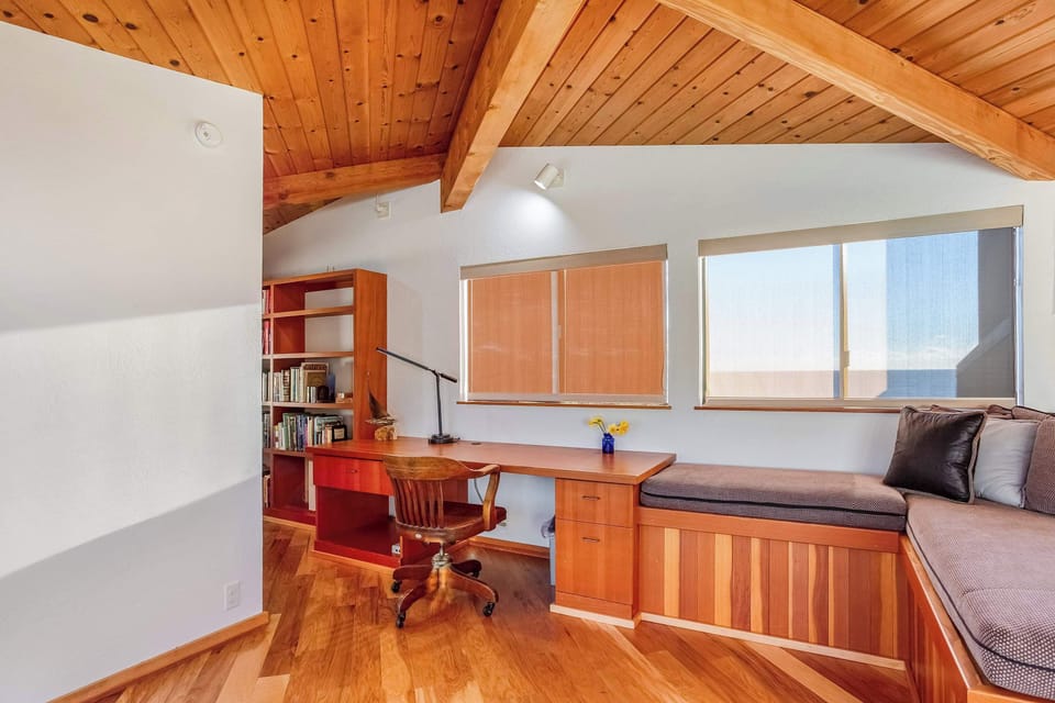 Create your perfect workspace in this inviting nook, where natural light and a peaceful view inspire you to stay focused and productive.