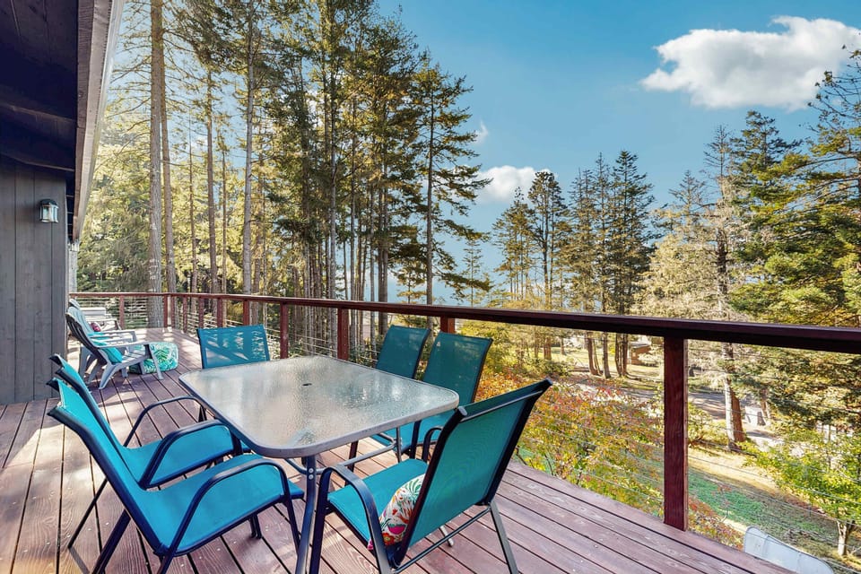 Sip your morning coffee on the spacious deck, surrounded by towering trees and the soothing sounds of nature.