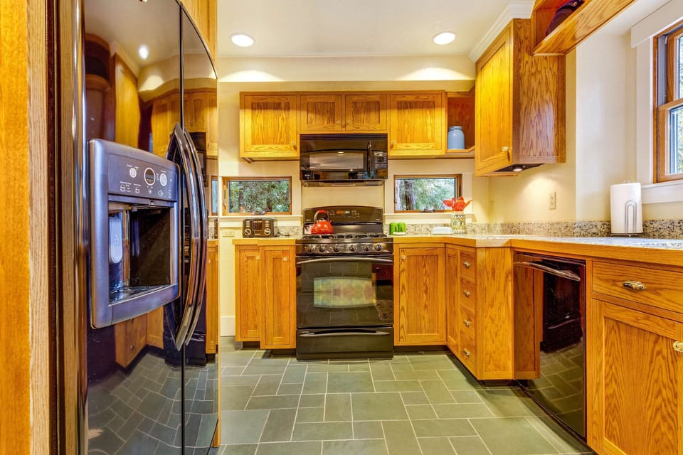 The kitchen's modern amenities make meal prep a joy, allowing you to savor every moment of your stay.