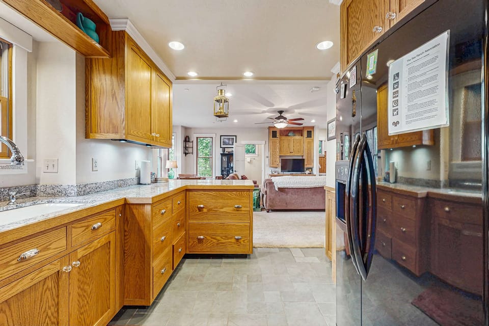 Cook up a feast in the well-equipped kitchen, where culinary creations come to life amidst natural light.