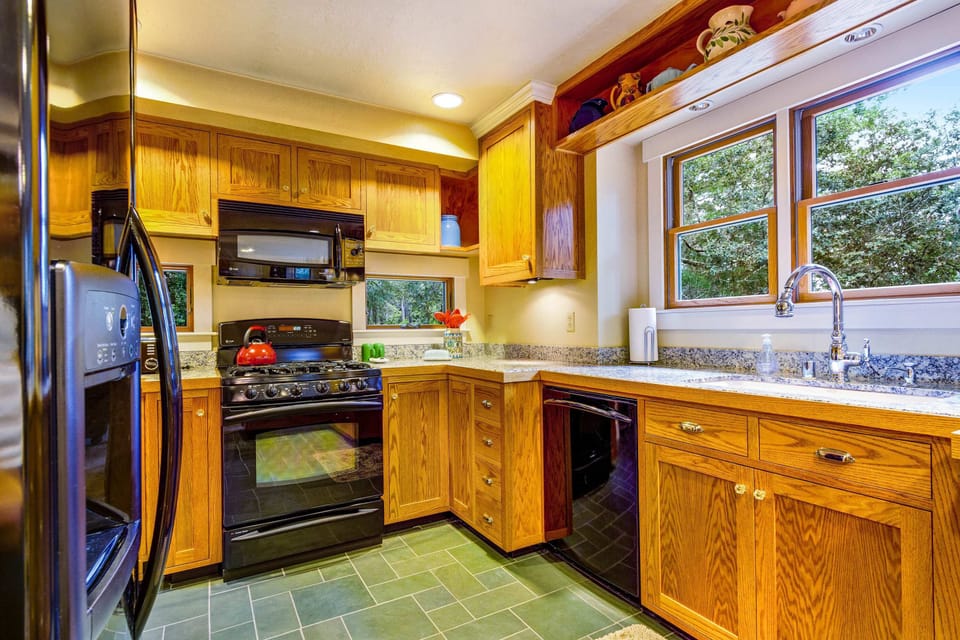 Embrace your inner chef in this kitchen, where every meal becomes a delightful experience amid warm wooden accents.