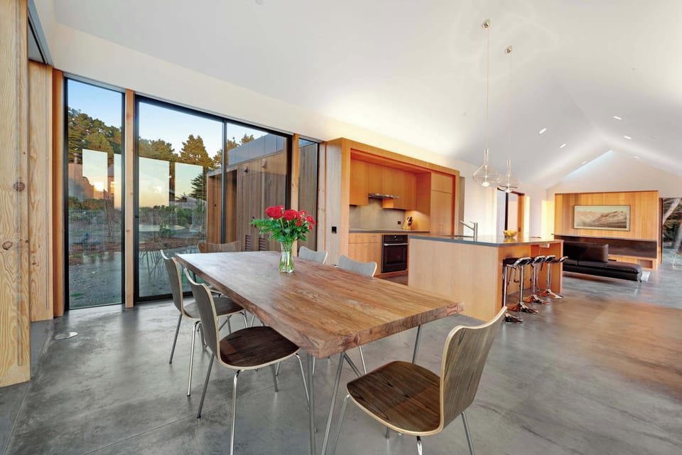 Enjoy the warmth of natural wood finishes in this stylish dining area, perfect for intimate dinners or game nights.