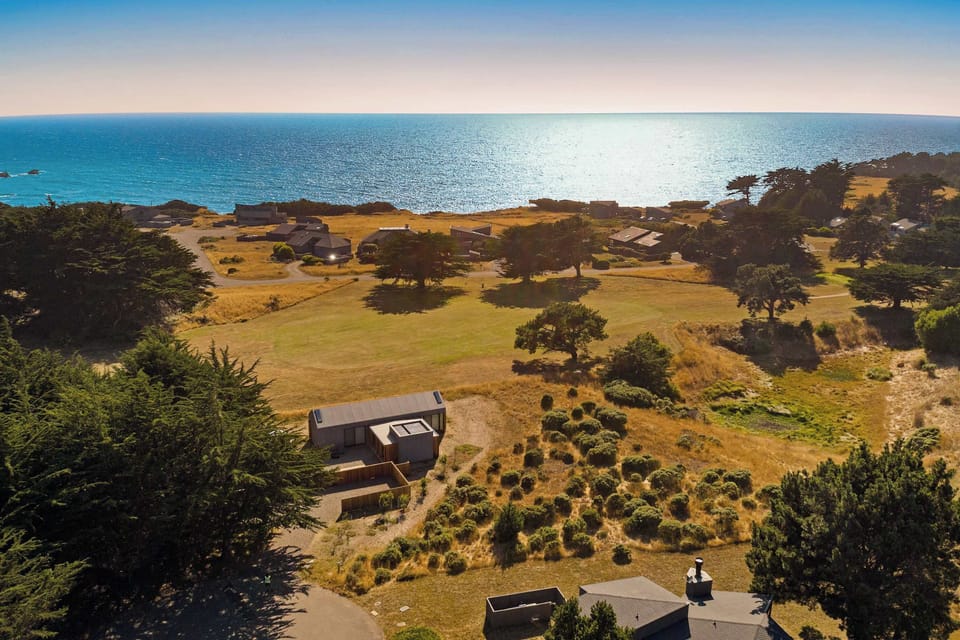 Delight in breathtaking views of the shimmering ocean and rolling hills, a perfect backdrop for your unforgettable getaway.