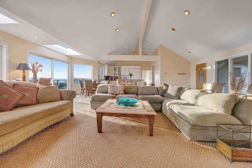 The inviting living room beckons you to unwind, with plush seating and an open layout designed for comfort and connection.