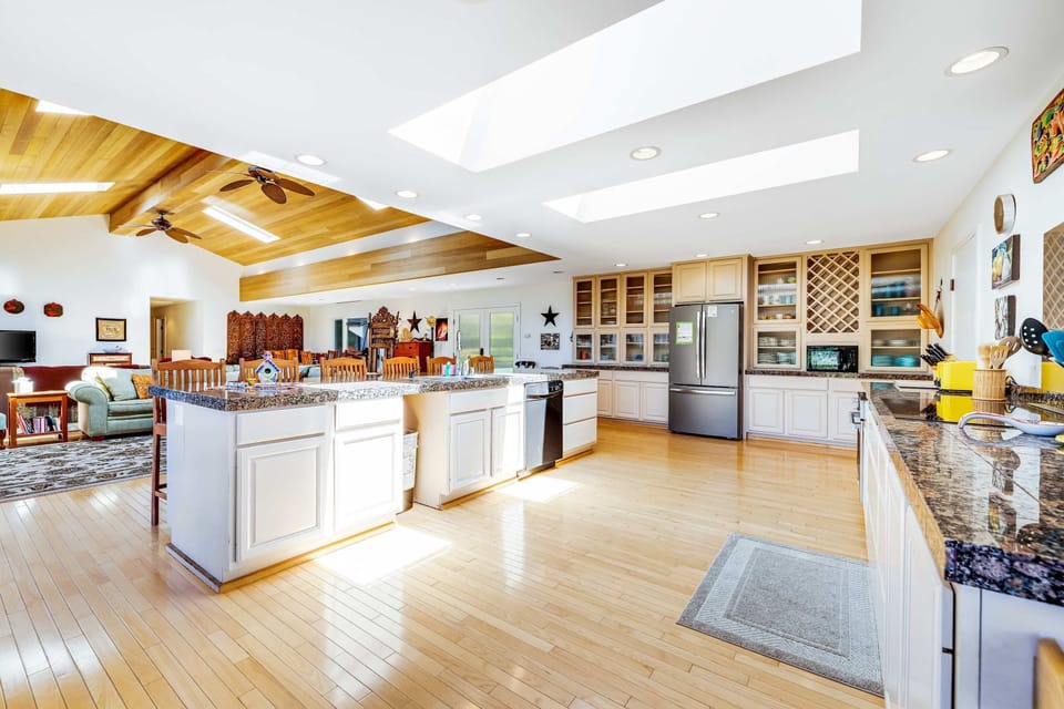 Cook up culinary delights in the well-equipped kitchen, designed for both functionality and socializing, making every meal an occasion.