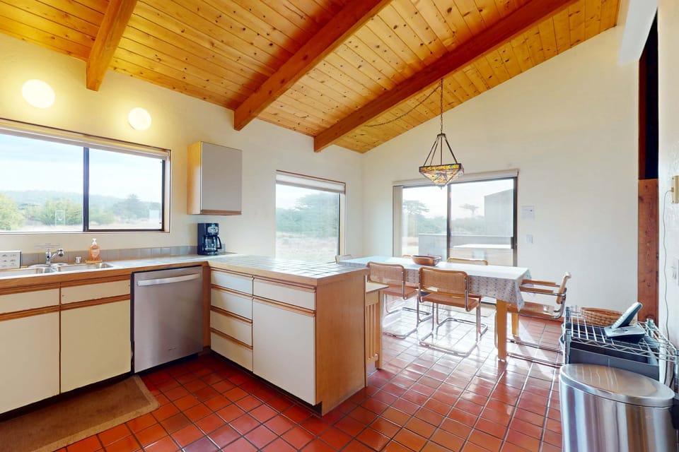 Enjoy morning coffee at the kitchen counter, basking in natural light while planning your day's coastal explorations.