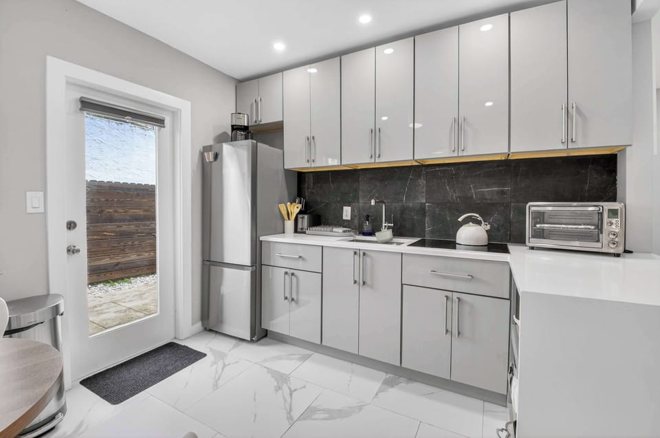 The airy kitchen offers ample space & all the comforts of home​