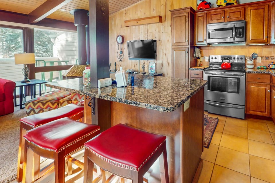 Cook in a full kitchen with stainless steel appliances