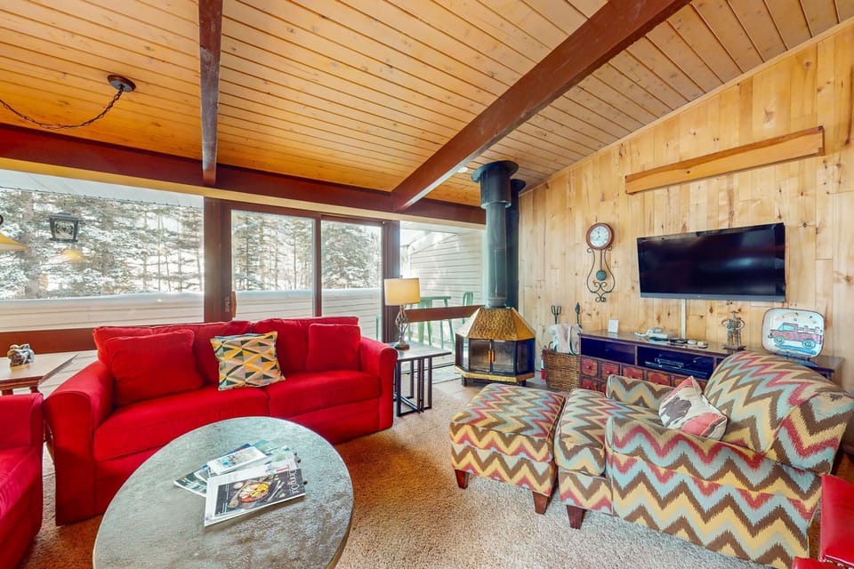 Cozy seating and forest views make for easy evenings in