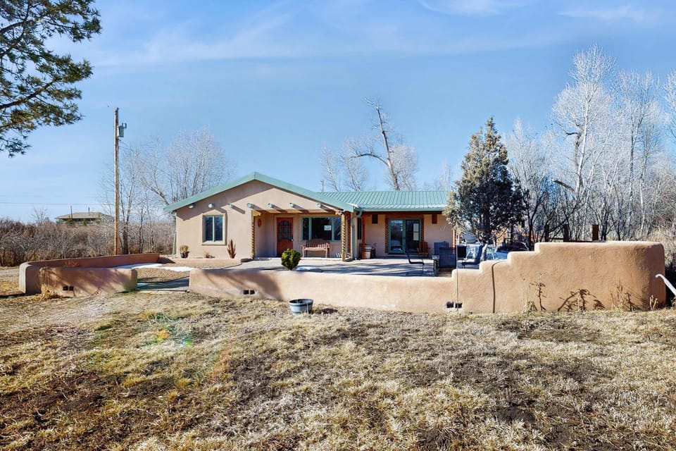 Spread out on a wide-open lot with mountain views in every direction