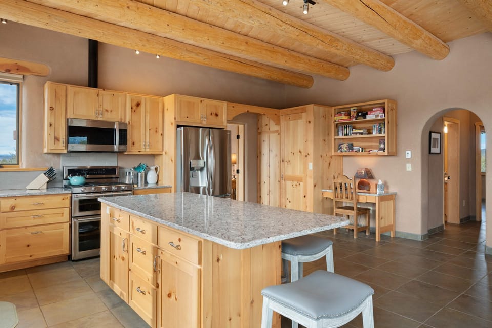 Gather around the granite island to cook and connect over a home-cooked meal
