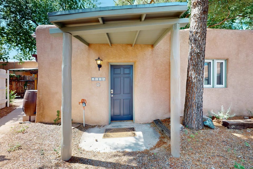 Enter through the covered portal with keyless smart-lock entry