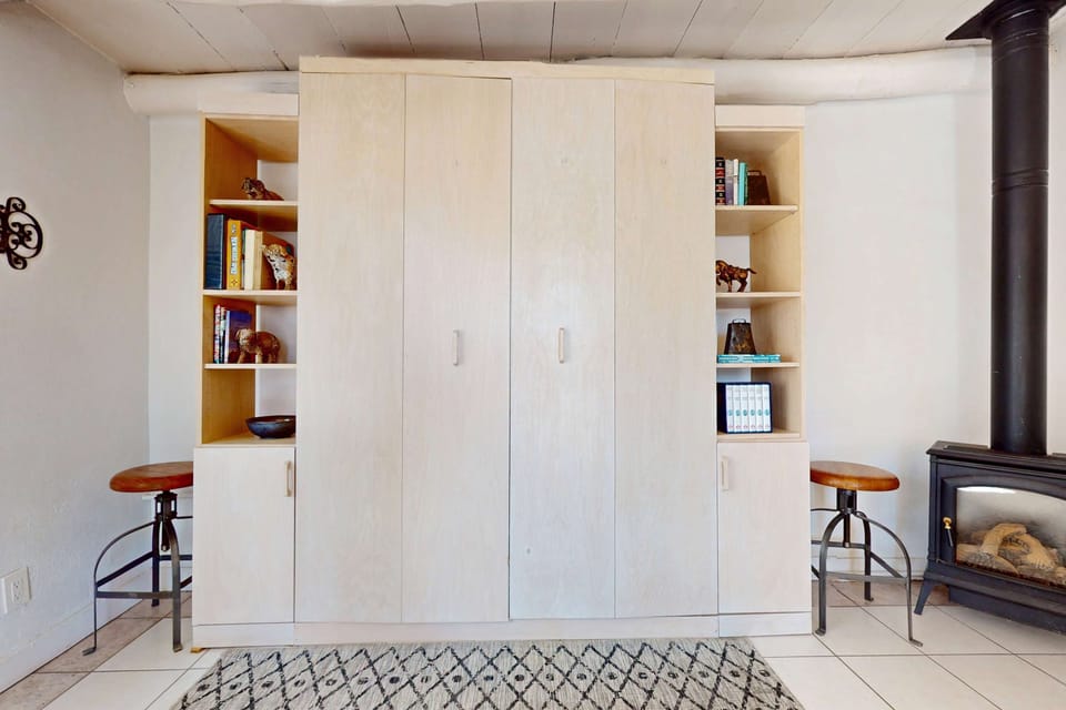 Tuck the queen Murphy bed away into its built-in by day