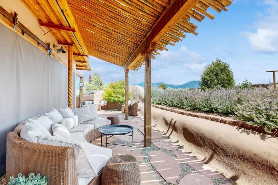 Sink into the covered porch sofas and let the mountain views do the rest