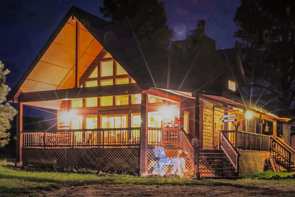 Watch the cabin glow as the stars come out over Angel Fire