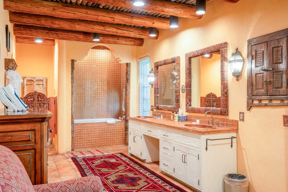 Soak in the primary ensuite with its hand-painted tile and double vanity