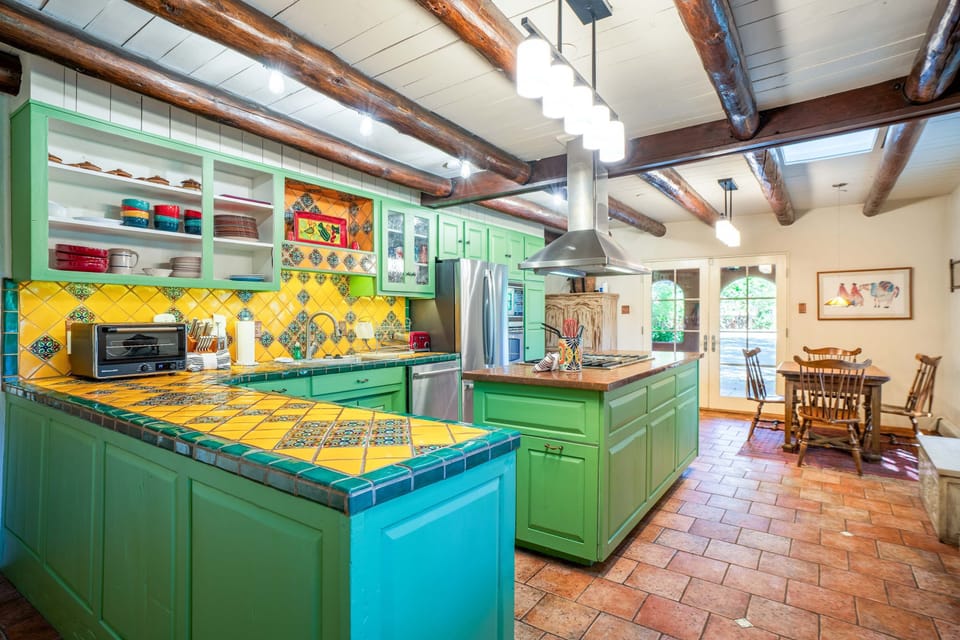 Cook together in the vibrant Talavera-tiled kitchen with island seating