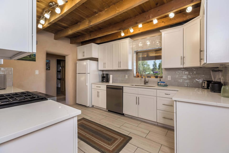 Gather around the island while someone works the gas cooktop