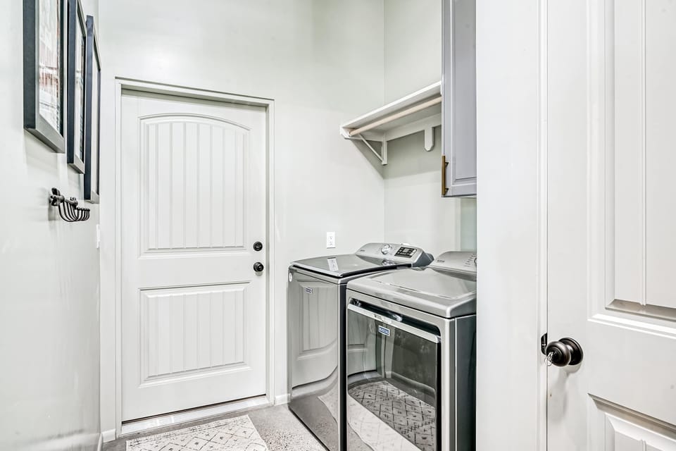 A private laundry room with a washer and dryer