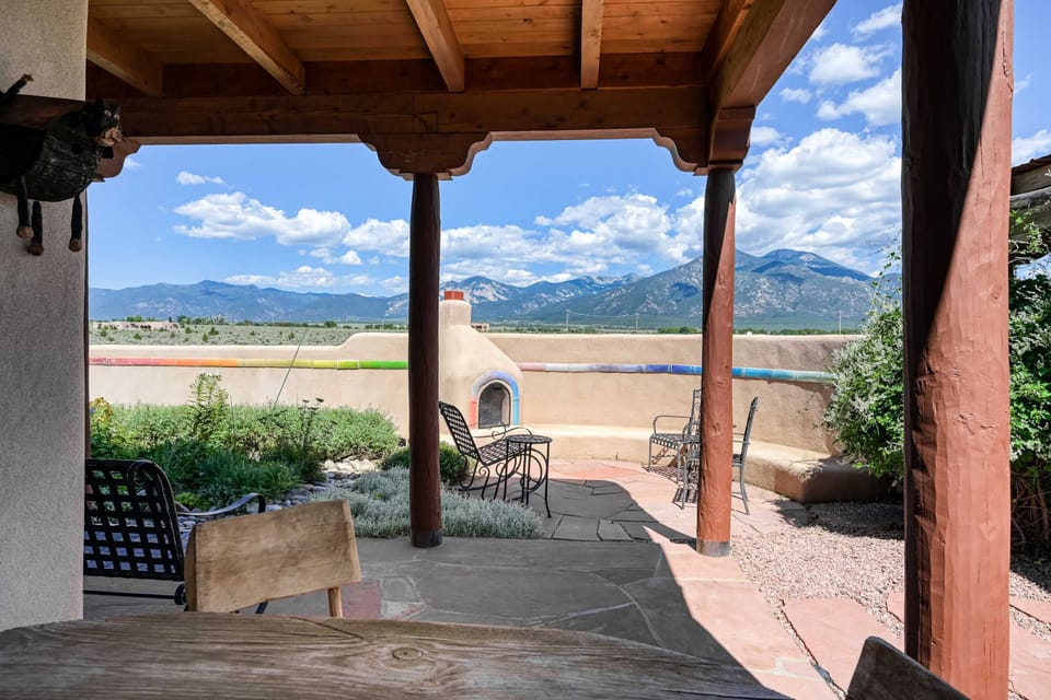 Flagstone patio and kiva fireplace facing the mountains