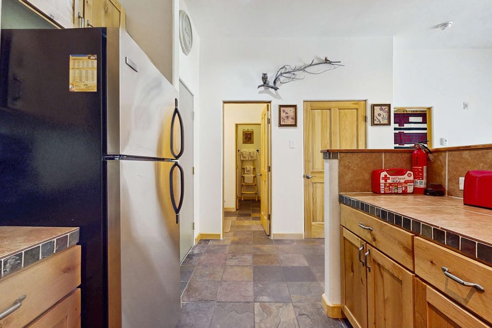 Find everything you need in the well-equipped kitchen near the entry