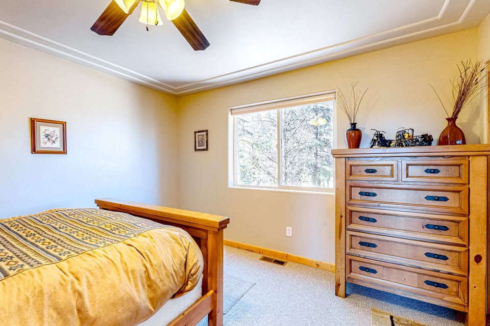 Find quiet and forest views in the main-level bedroom