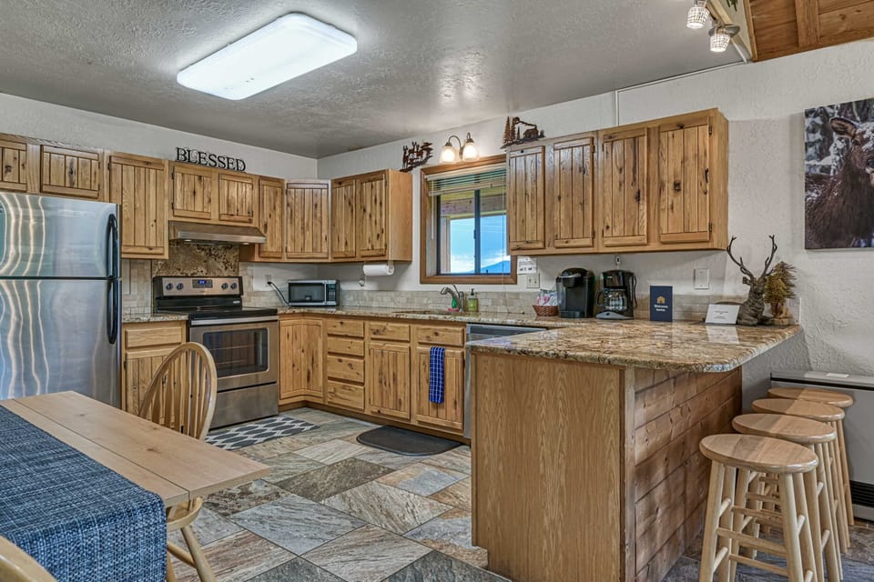 Warm wood accents and full-size appliances make meals easy