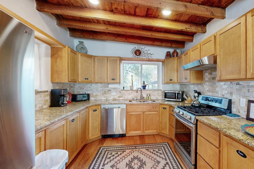 Cook in the granite chef's kitchen with stainless steel appliances
