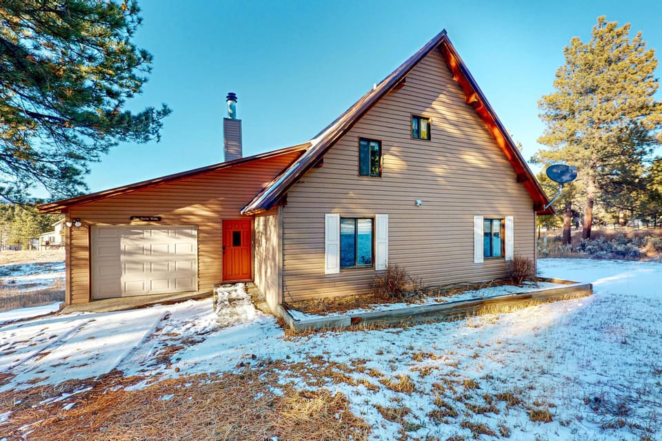 Arrive at the chalet-style cabin with its own garage