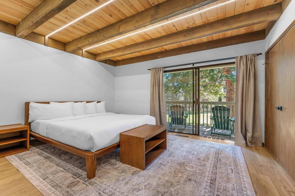 1st Floor Master Bedroom cal king bed with private balcony looking out to courtyard