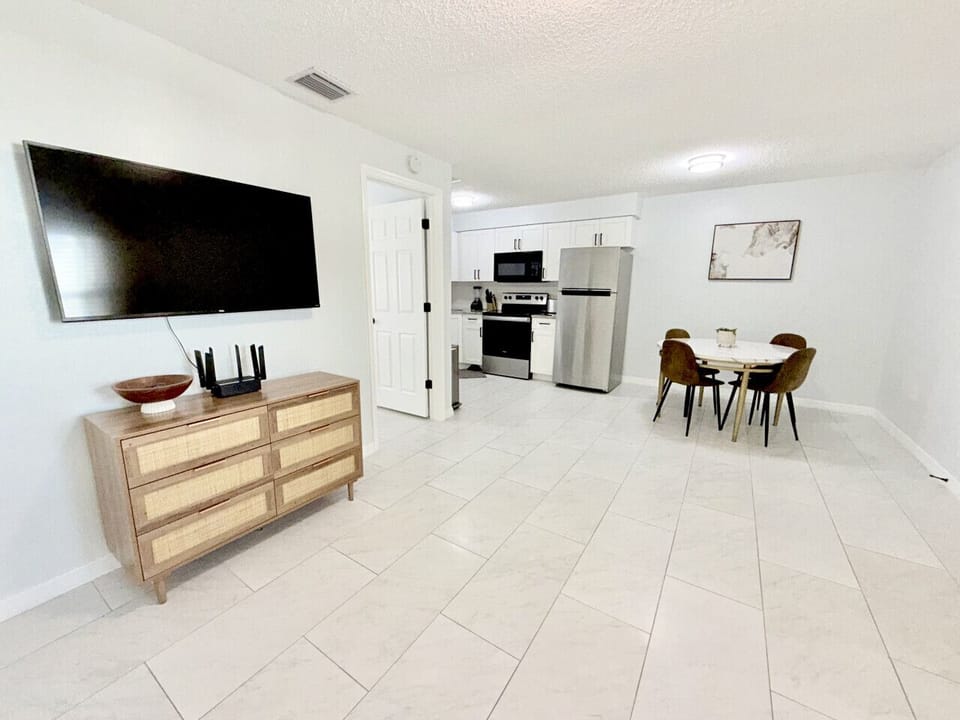 Bright dining area with seating for four, just steps from the fully equipped kitchen.