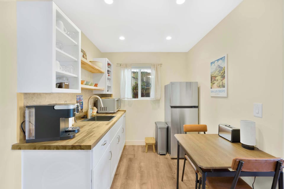 Fully stocked kitchenette w/ fridge, toaster oven, coffee machines, etc.