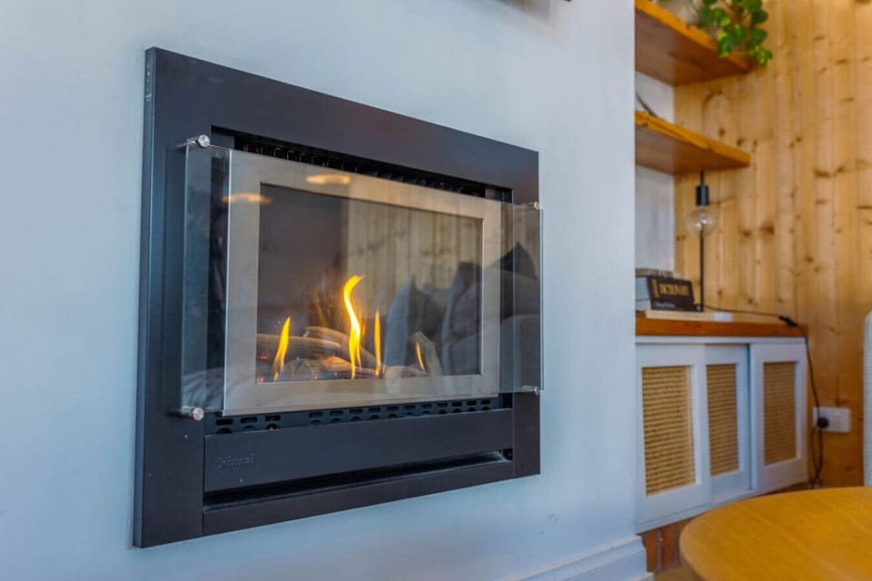 Gorgeous gas fireplace glowing warmly on a cozy evening