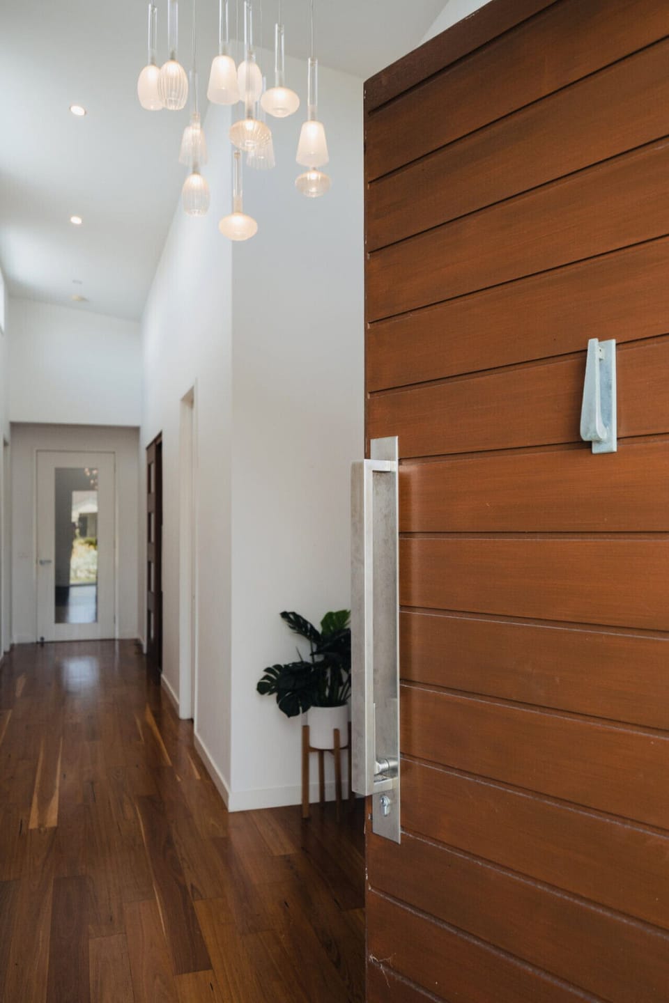 A grand entrance glowing with gorgeous pendant lights