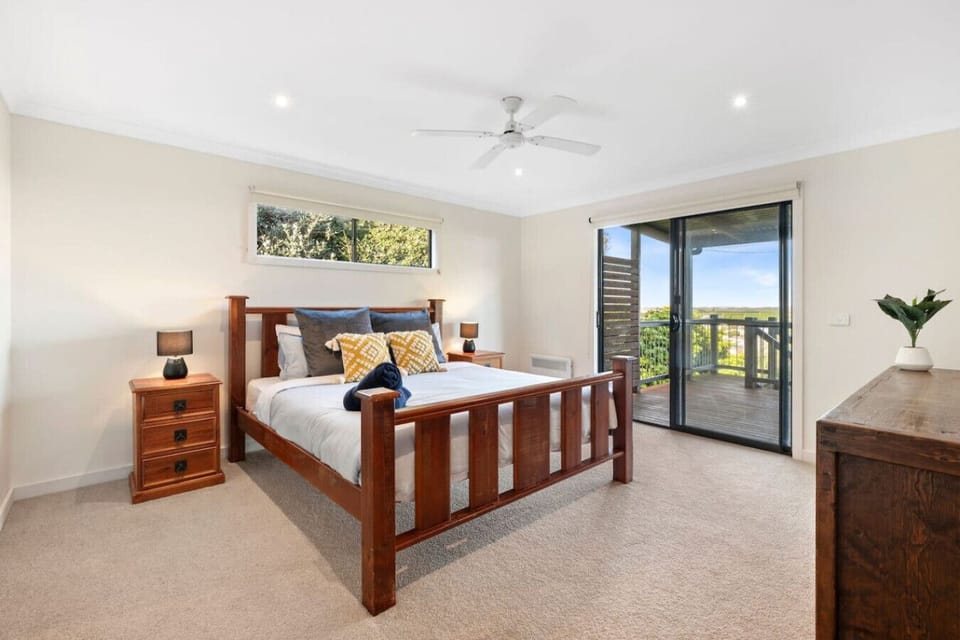 Bedroom 3: Spacious bedroom with balcony access and calming views