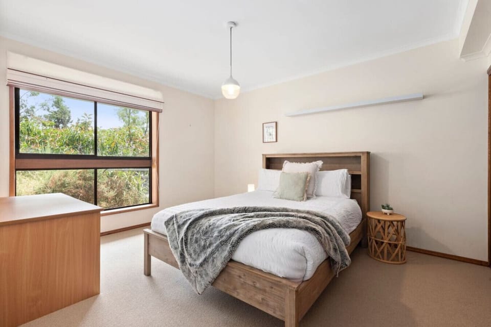 Bedroom 1: Cozy bedroom with soft linens and garden views