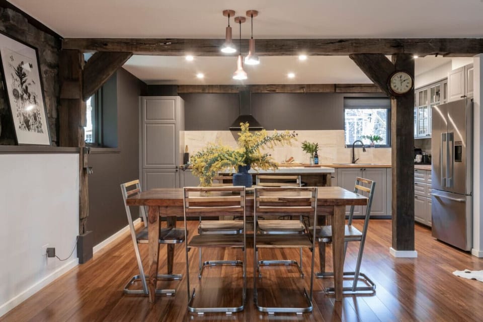 Inviting dining area with charming rustic beam details