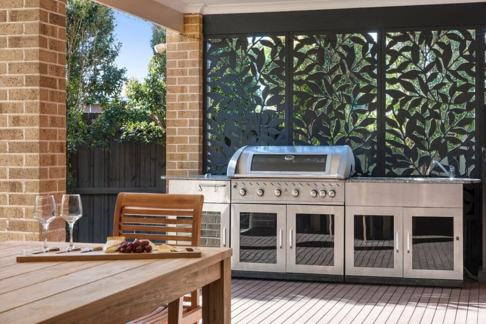 Premium BBQ, laser-cut screen & wine glasses ready. Date night outside.